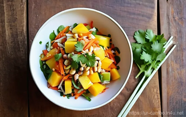 캄보디아 망고 샐러드 - **Vibrant Cambodian Mango Salad on a Summer Table:** A close-up shot of a beautifully presented Camb...